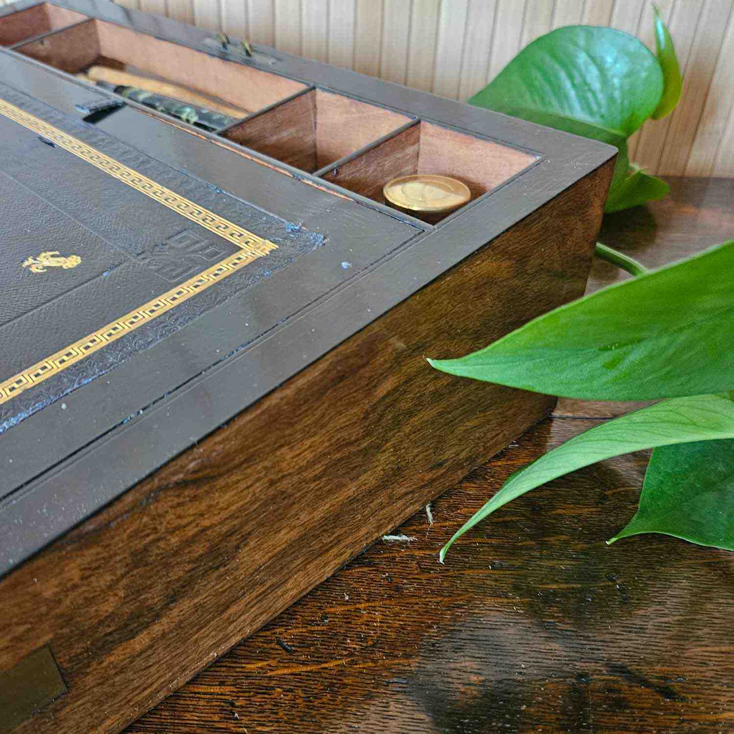 Antique walnut writing slope with brass corners