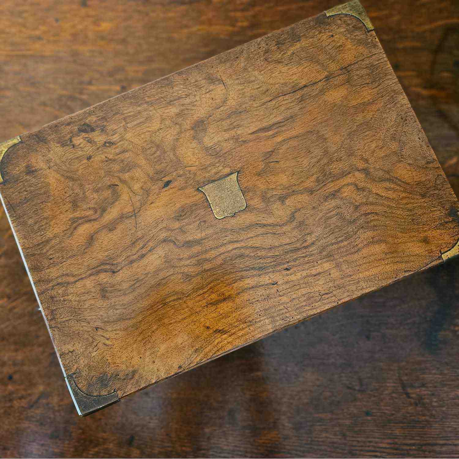 Antique walnut writing slope with brass corners