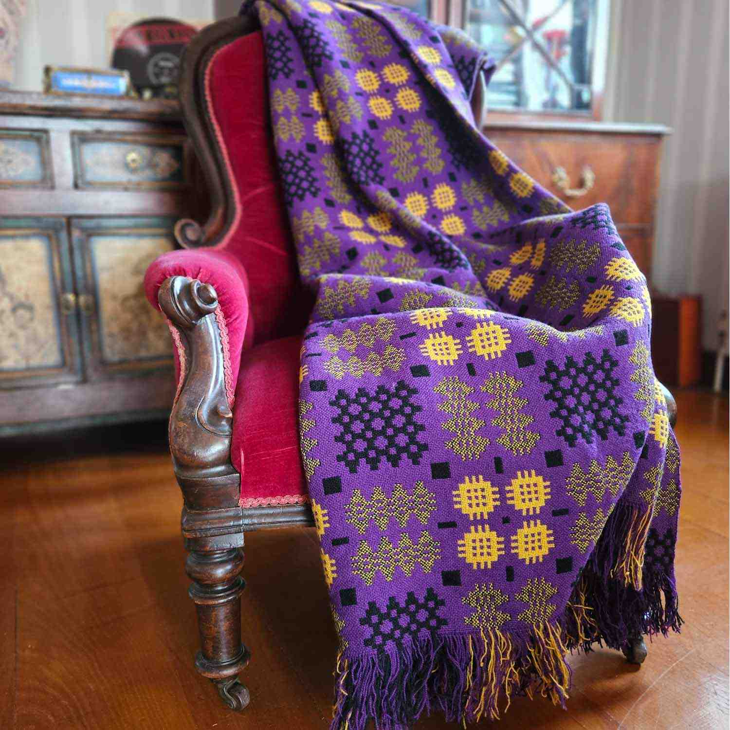 Vintage Welsh blanket in purple, yellow, and black