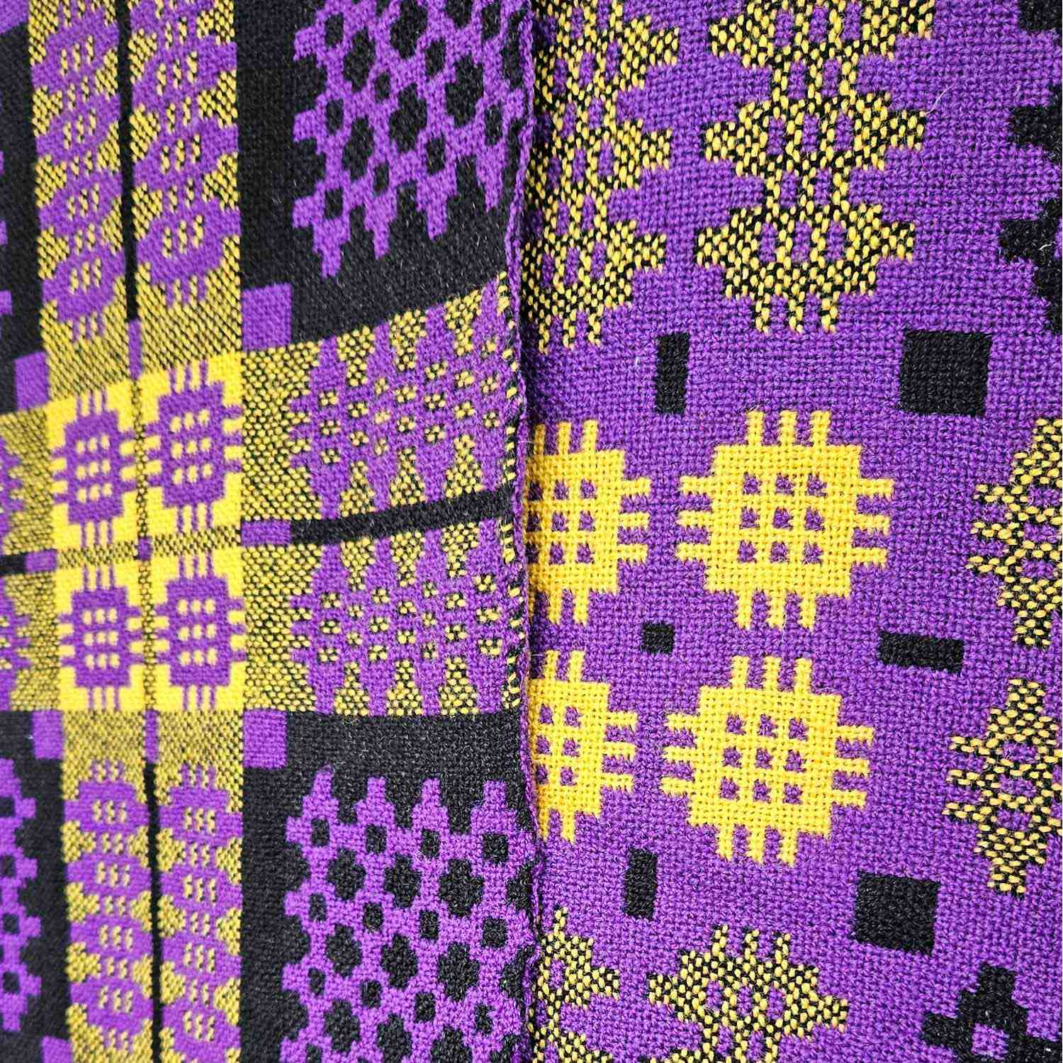 Vintage Welsh blanket in purple, yellow, and black