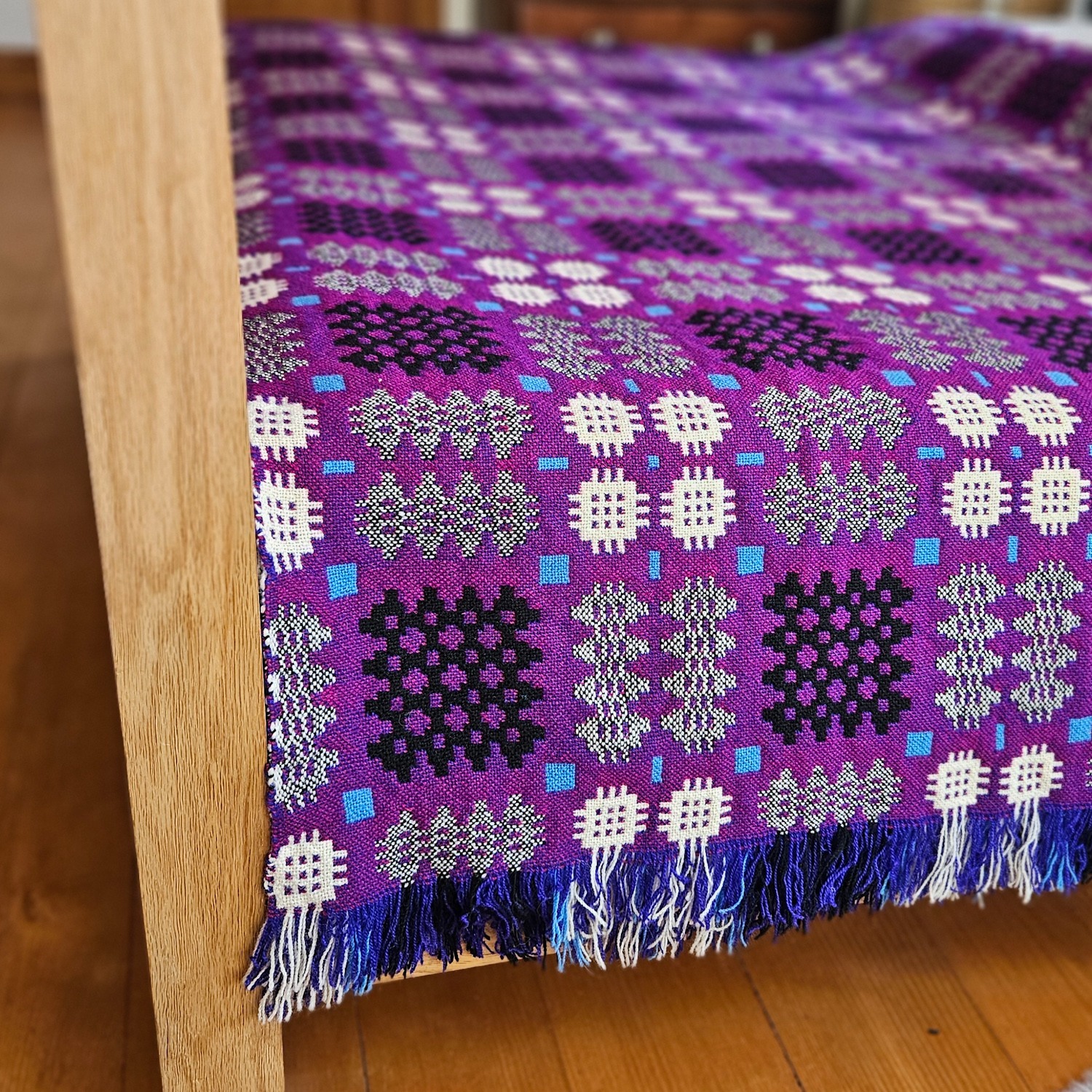 Vintage Welsh blanket in purple, aqua, black, cream