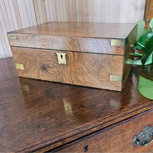 Antique walnut writing slope with brass corners