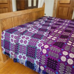 Vintage Welsh blanket in purple, aqua, black, cream